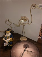 Pelicans, Santa, and clock