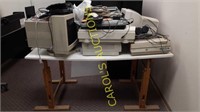 Wood table / desk with lots of electronics on top