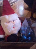 Santa clause with blue Christmas ornaments