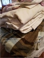 Variety of sheets and blankets