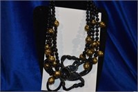 4 strand black &goldtone glass beaded necklace