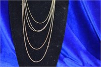 3 gold tone chain and 1 double chain