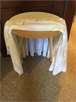 Small round table with table cloth