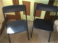 2 Black Plastic Folding Chairs