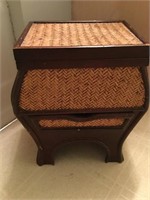 small wicker like stand with drawer