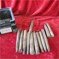 (12) antique wood pegs with plastic crate.