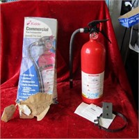 New unused commercial fire extinguisher. Box