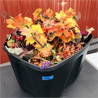 Tote of artificial fall flowers and leaves