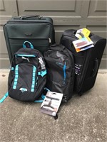Two Suitcases and Two Day Packs