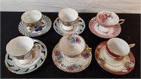 SIX LUSTRE CUPS AND SAUCERS