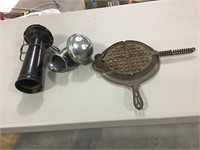 Car horns and half of a Griswold waffle maker