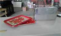 5 metal trays and a breadbox