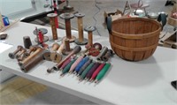 Wood spools and thread in a basket