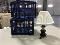 Pair of plastic storage crates and a small lamp