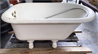 Small cast iron claw foot tub with shower ring