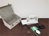 Sewing machine with manual and case
