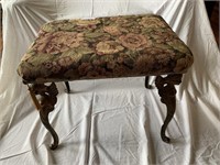 Stool on cherub form legs with upholstered top