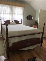 Walnut full size bed with rose carved footboard