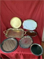 7 unmatched serving trays, 2 brass, 4 silver