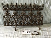 CAST IRON GRATE W HOOKS. (Broken, pieces with it)