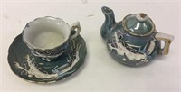 Miniature ceramic Japanese teapot and teacup