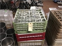 Three dishwasher racks full of assorted glassware