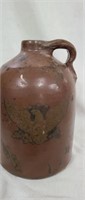 Vintage pottery jug with an eagle on it