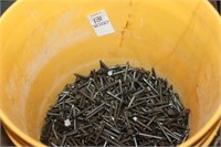 BUCKET OF CONCRETE NAILS