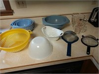 colanders, mixing bowls, measuring cups