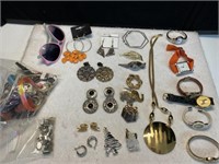Earrings, watches, pins, sunglasses, and bags of