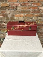 red metal tool box with tray