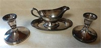 silver plated gravy boat and candlesticks
