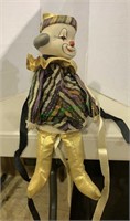 Music box clown figure, sits on the shelf, plays