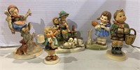 Four vintage Hummel figures, and another girl with