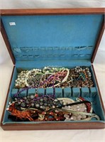 Silverware chest filled with costume necklaces,