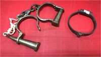 Early style iron handcuffs, one cuff looks to be