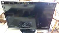 Vizio 32 inch flat screen TV, with some cables,