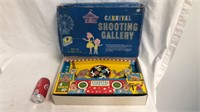 Vintage wind up toy shooting gallery with the