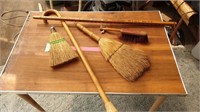 Cane, vintage brooms and advertising yard stick