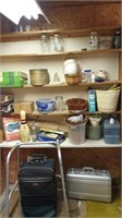 Contents of shelf and items in front of shelf