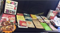 Assorted cookbooks, pot holders and Hot pad hands