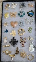 Group of brooches and pins