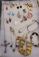 Group of earrings, bracelets, and Cross necklace