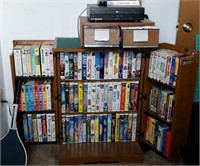 Cabinet full of VHS movies plus everything on top