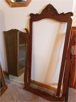 Antique beveled glass mirror with frame.