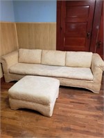 Long sofa with ottoman.  Needs cleaned.