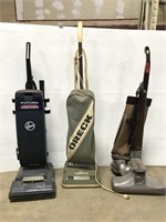 Three vacuum cleaners
