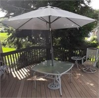 4ft patio table with umbrella. Glass top with