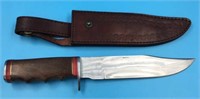 Fixed bladed knife, steel guard and end cap, wood