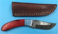Damascus bladed knife with wood scales, steel bols